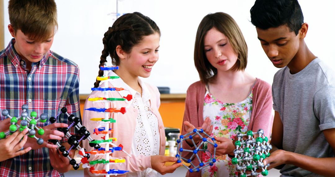 Diverse group of students examining molecular models in science class - Free Images, Stock Photos and Pictures on Pikwizard.com