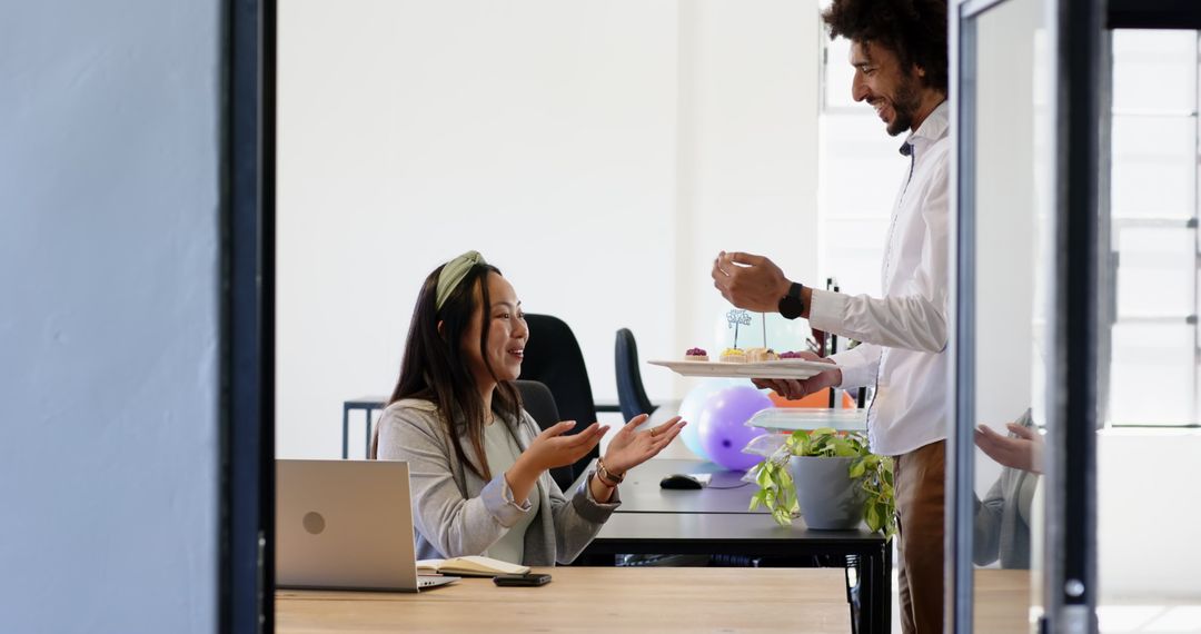 Office Celebration with Co-workers Sharing Cake