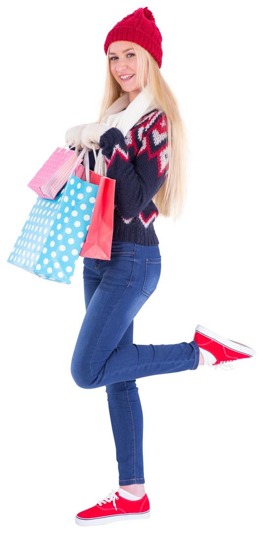 Festive Blonde Woman in Winter Attire Holding Shopping Bags - Download Free Stock Images Pikwizard.com