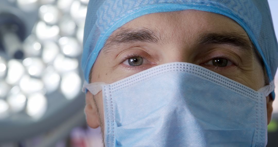 Healthcare Professional Wearing Surgical Mask in an Operating Room - Free Images, Stock Photos and Pictures on Pikwizard.com