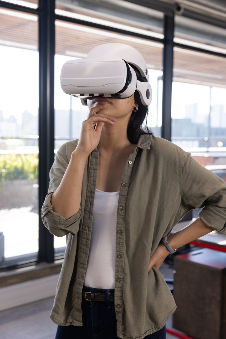Woman in Modern Workspace Exploring Virtual Reality Technology
