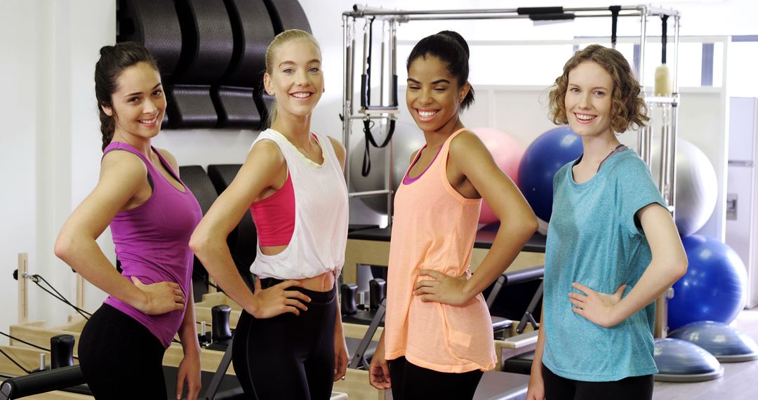 Diverse group of women in fitness studio ready for pilates class - Free Images, Stock Photos and Pictures on Pikwizard.com