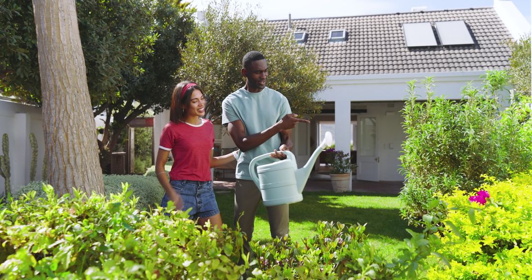 Couple Caring for Garden Together in Suburban Yard