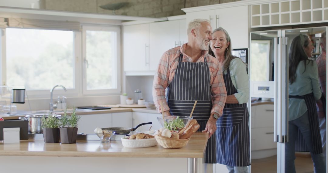 Middle Aged Caucasian Couple Cooking Together in Modern Kitchen - Free Images, Stock Photos and Pictures on Pikwizard.com