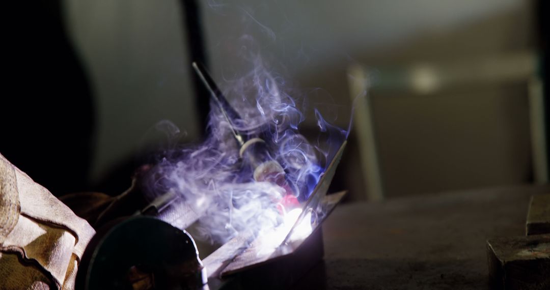 Welder Using Arc Welding Technique with Smoke and Sparks - Free Images, Stock Photos and Pictures on Pikwizard.com