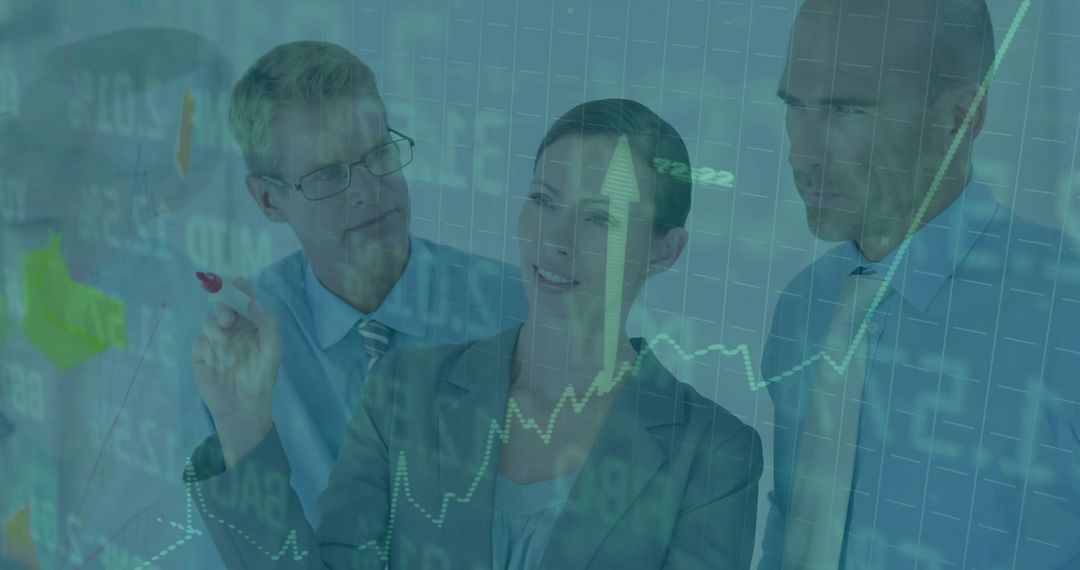 Business team analyzing financial charts on glass wall with upward arrow and marker