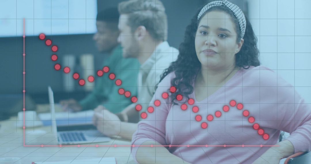 Diverse Team Analyzing Graph in Modern Office Environment