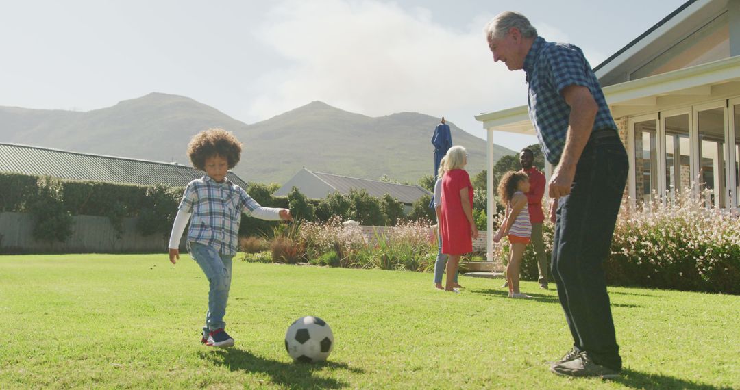 Image of diverse family in playing football match outside - Free Images, Stock Photos and Pictures on Pikwizard.com