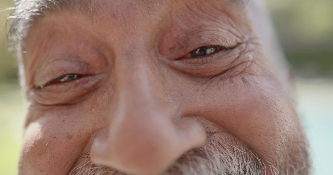 Close-Up Portrait of Elderly Man with Wrinkled Skin and Smile - Free Images, Stock Photos and Pictures on Pikwizard.com