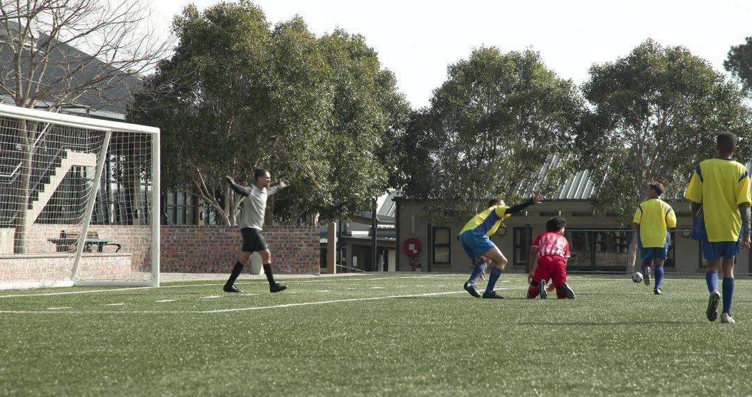 Soccer Players Strategizing During Practice on Field