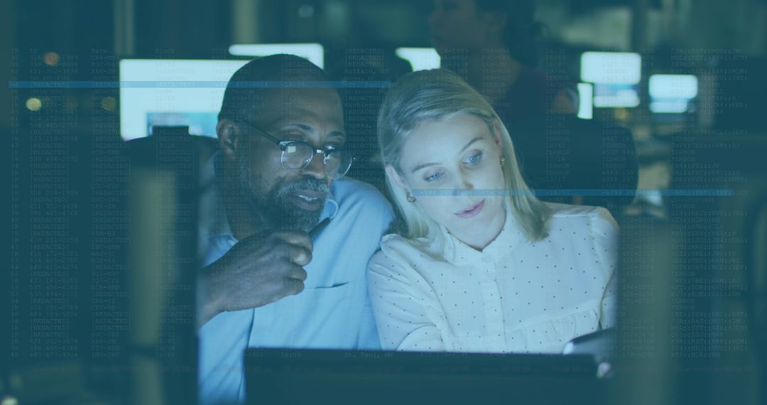 Diverse Colleagues Collaborating on Digital Project with Laptop