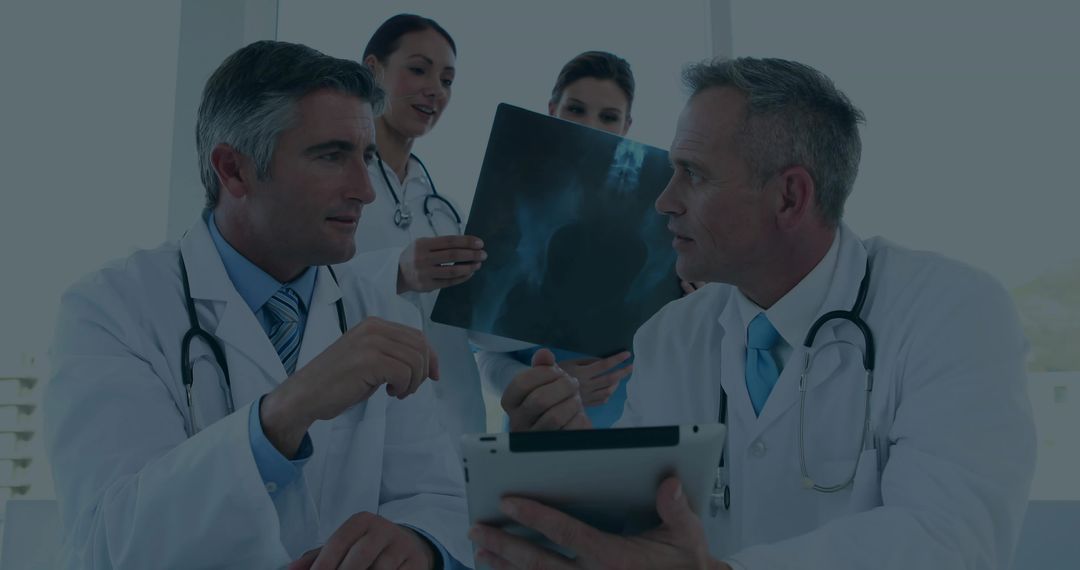 Medical Team Analyzing Diagnostic Imaging with Modern Technology