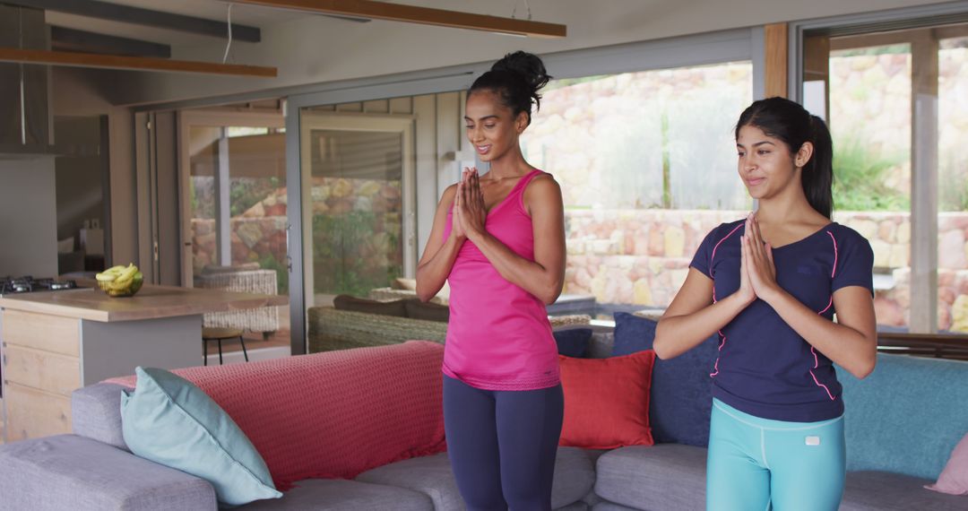 Women Practicing Yoga Together in Modern Living Room - Free Images, Stock Photos and Pictures on Pikwizard.com