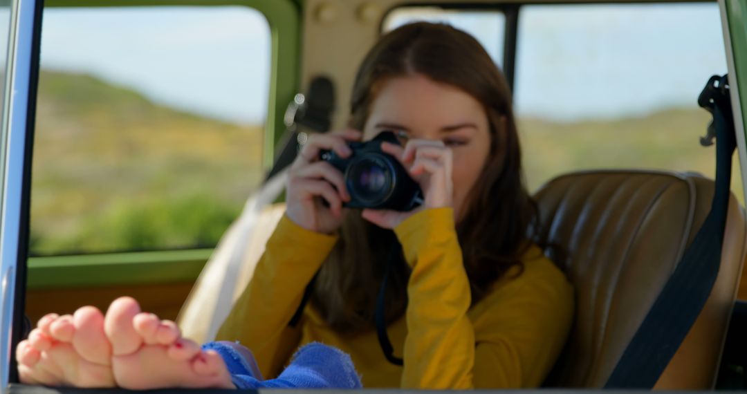 Young Woman Taking Photos from Car Window on Road Trip - Free Images, Stock Photos and Pictures on Pikwizard.com