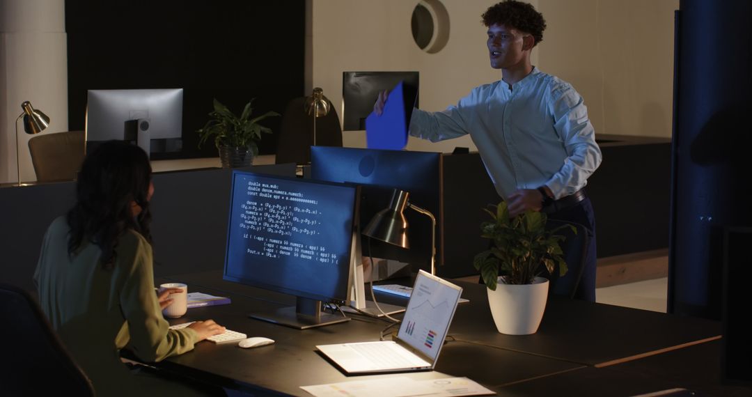Diverse Team Collaborating Late in Office