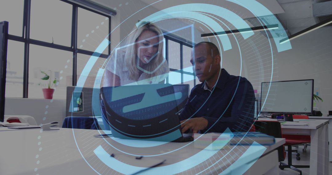 Team collaborating over laptop with augmented reality overlay in modern open office studio