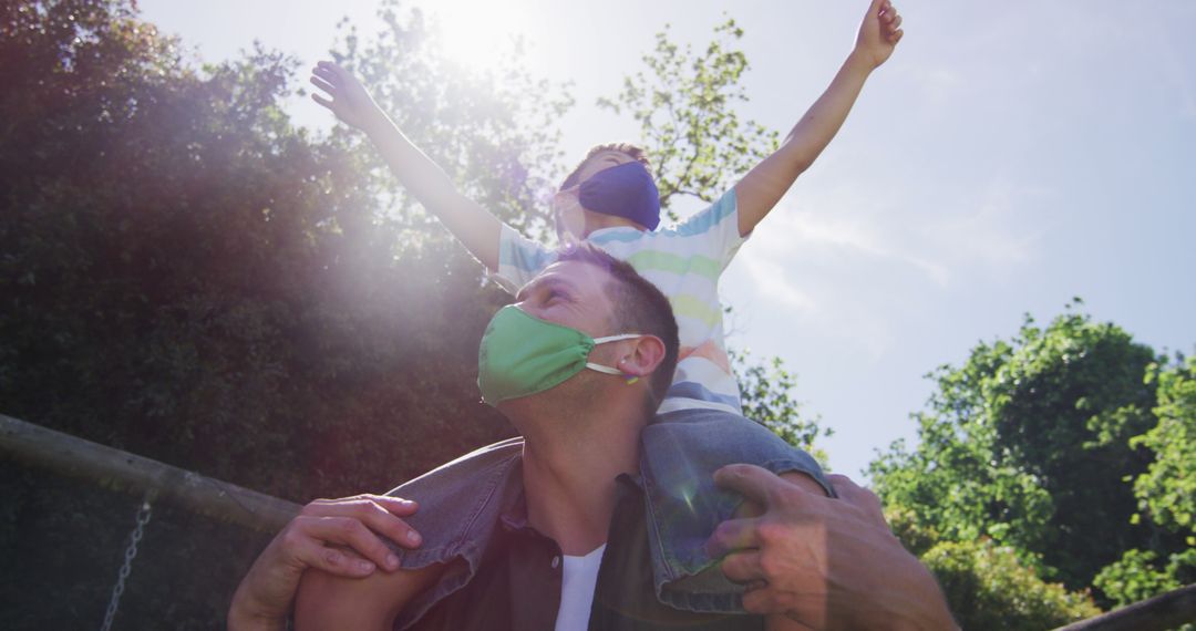 Father and Child Enjoying Nature While Wearing Face Masks - Free Images, Stock Photos and Pictures on Pikwizard.com