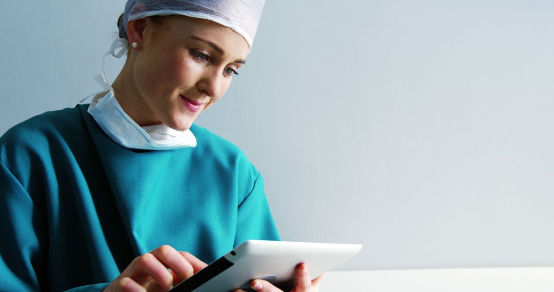 Female Doctor Using Tablet Computer in Hospital - Free Images, Stock Photos and Pictures on Pikwizard.com