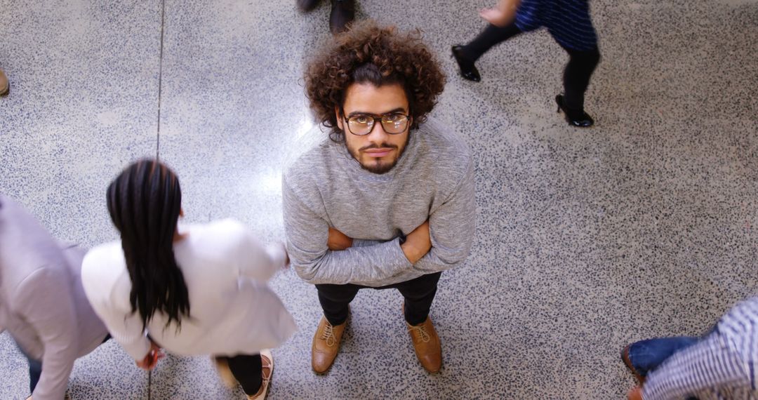 Confident Young Professional in Busy Office Environment