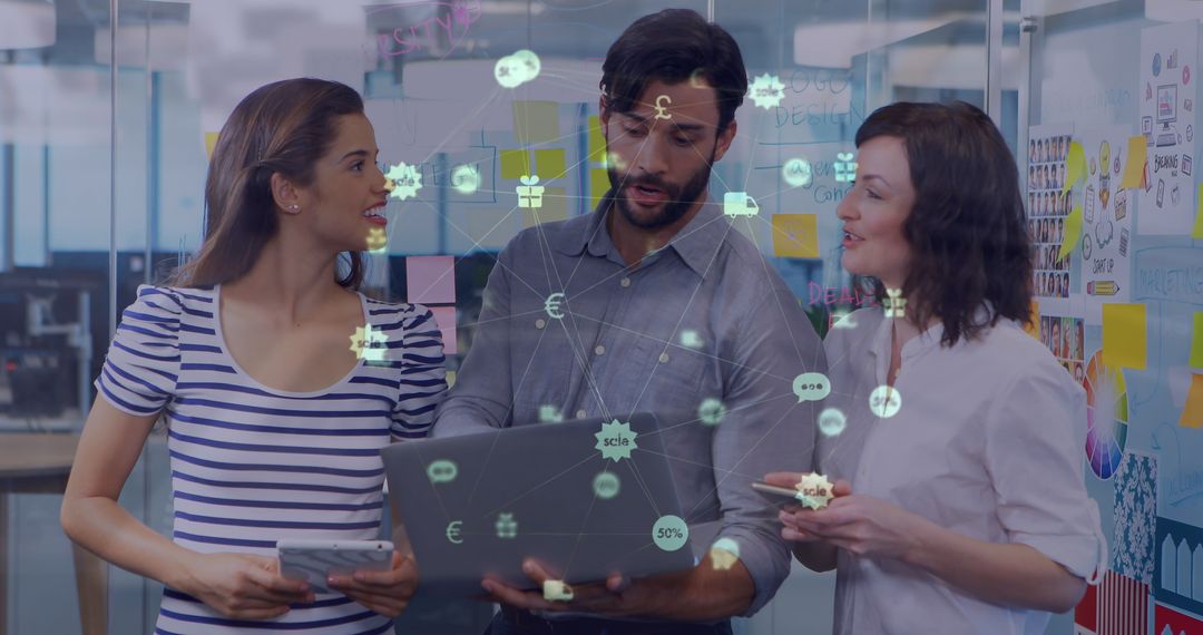 Diverse Colleagues Collaborating on Technology Project in Office Setting