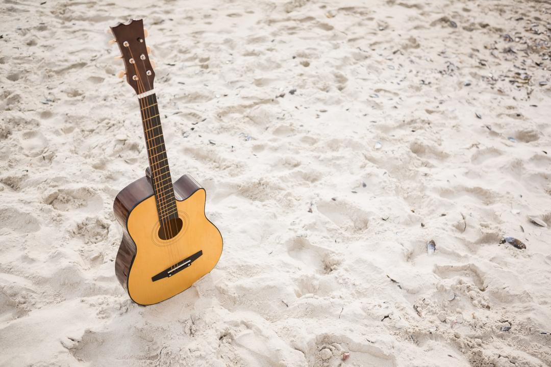 Acoustic Guitar Standing in Sand on Tropical Beach - Free Images, Stock Photos and Pictures on Pikwizard.com