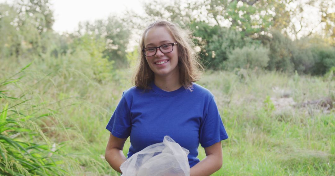 Happy Volunteer Engaging in Eco-Friendly Clean-Up Effort