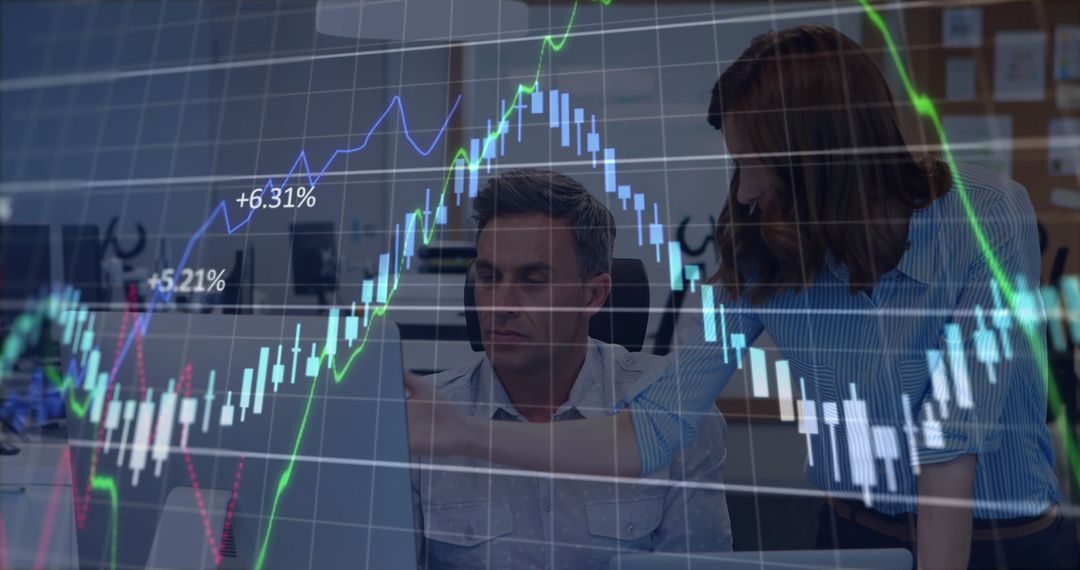 Business Analysts Discussing Data with Interactive Charts Overlay