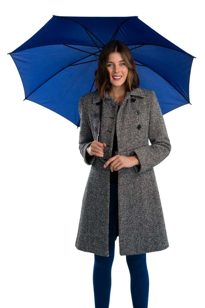 Portrait of smiling young woman holding umbrella - Free Images, Stock Photos and Pictures on Pikwizard.com