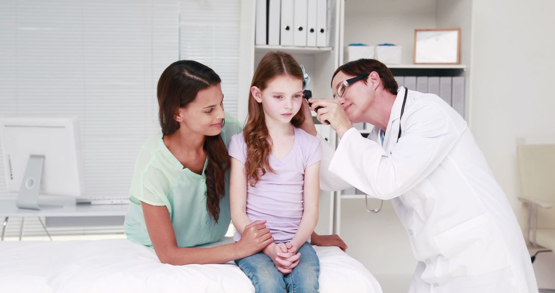 Pediatric Doctor Examining Young Girl With Concerned Mother - Free Images, Stock Photos and Pictures on Pikwizard.com