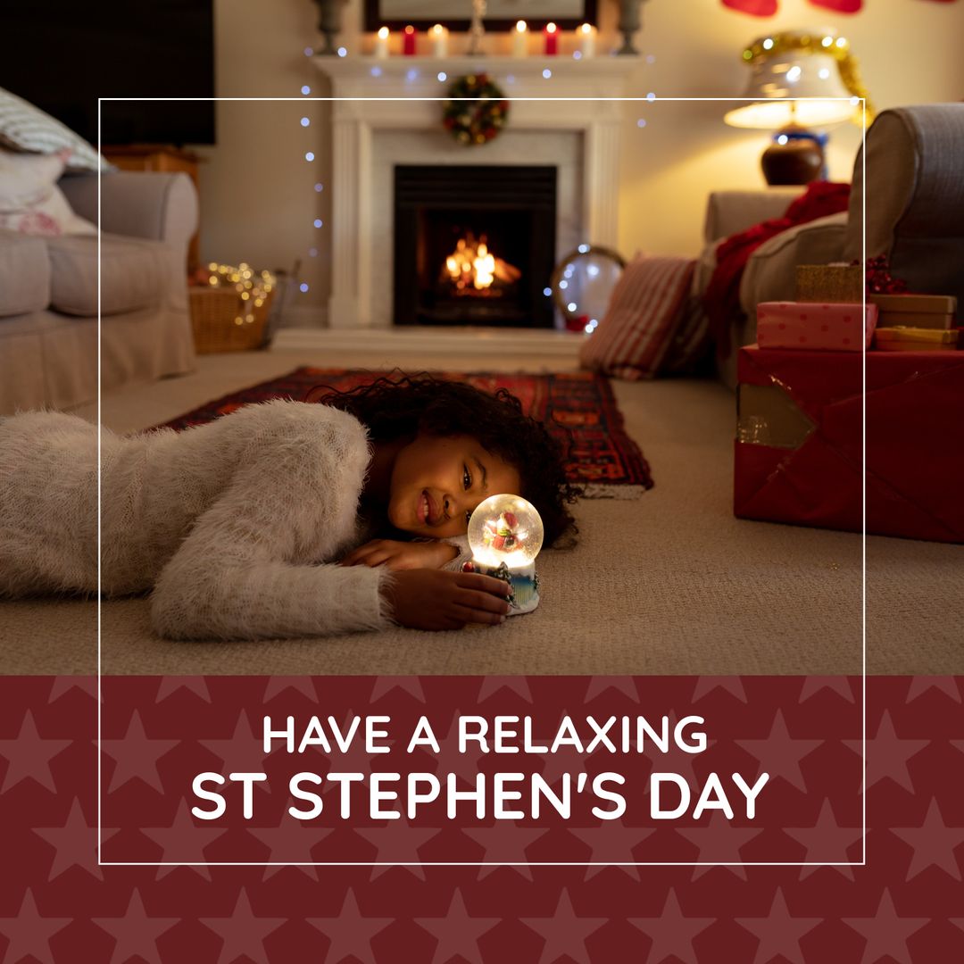 Biracial Girl Relaxing at Christmas by Fireplace Holding Snow Globe - Download Free Stock Templates Pikwizard.com