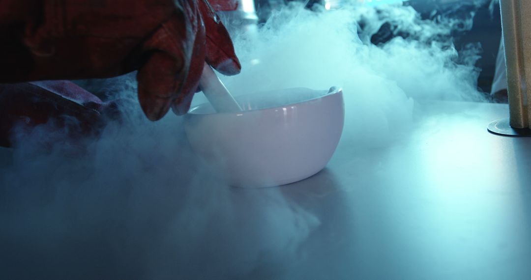 Scientist Using Mortar and Pestle with Liquid Nitrogen for Experiment - Free Images, Stock Photos and Pictures on Pikwizard.com