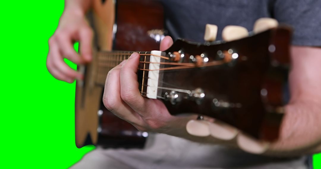 Man playing acoustic guitar close-up on green screen background - Free Images, Stock Photos and Pictures on Pikwizard.com