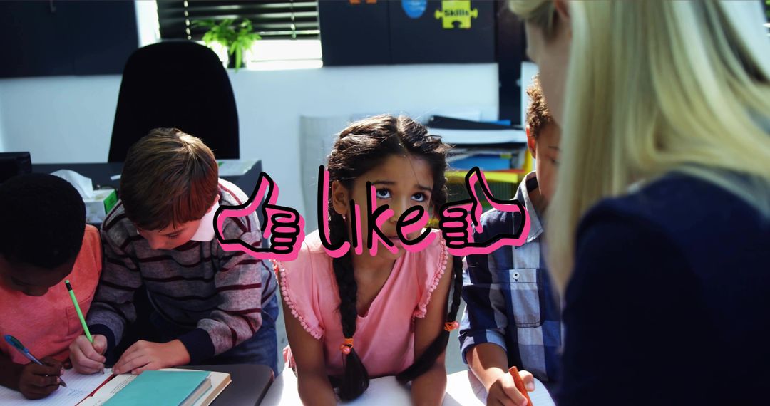 Teacher guiding elementary students during collaborative learning session with pink like graphic