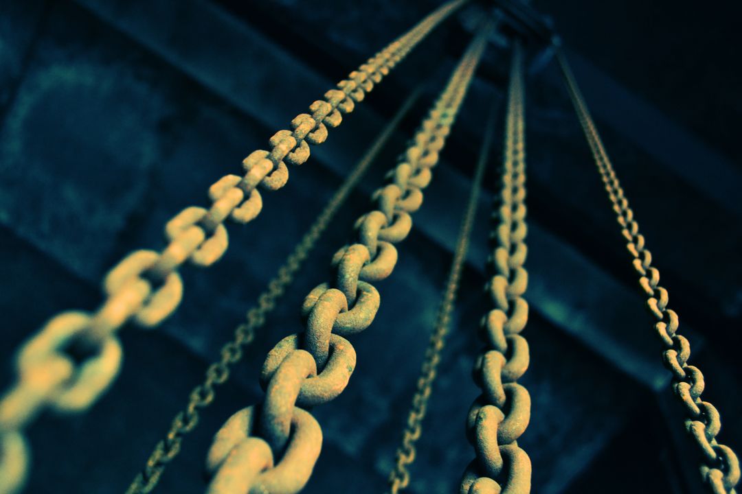 Rusty Chains Stretching Upward in Industrial Close-up