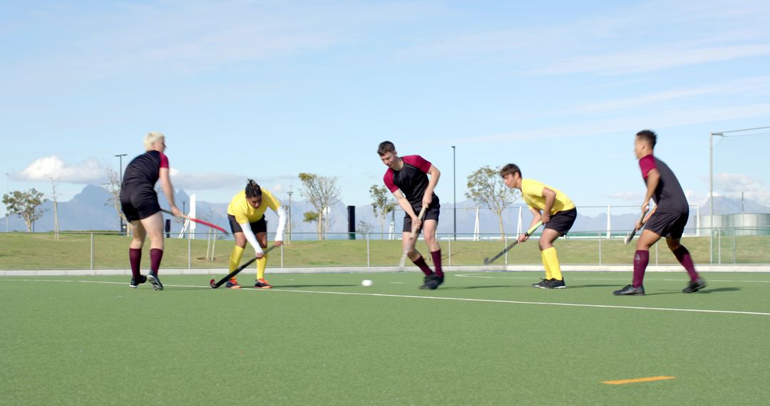 Dynamic Field Hockey Match in Action with Athletes Competing Outdoors