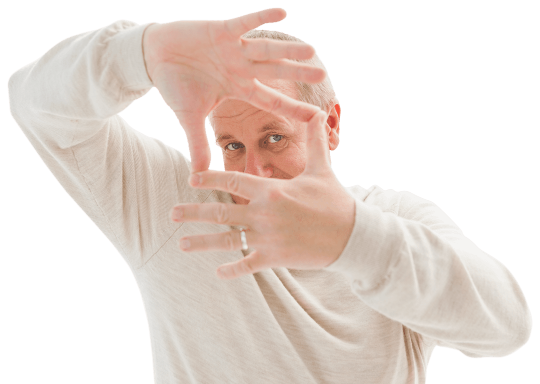 Transparent Mature Man Framing Face with Hands Confident Expression