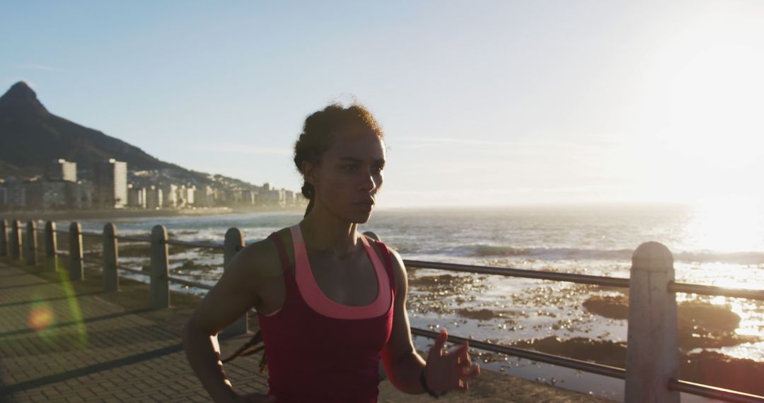 Woman Jogging Along Oceanfront at Sunrise - Free Images, Stock Photos and Pictures on Pikwizard.com