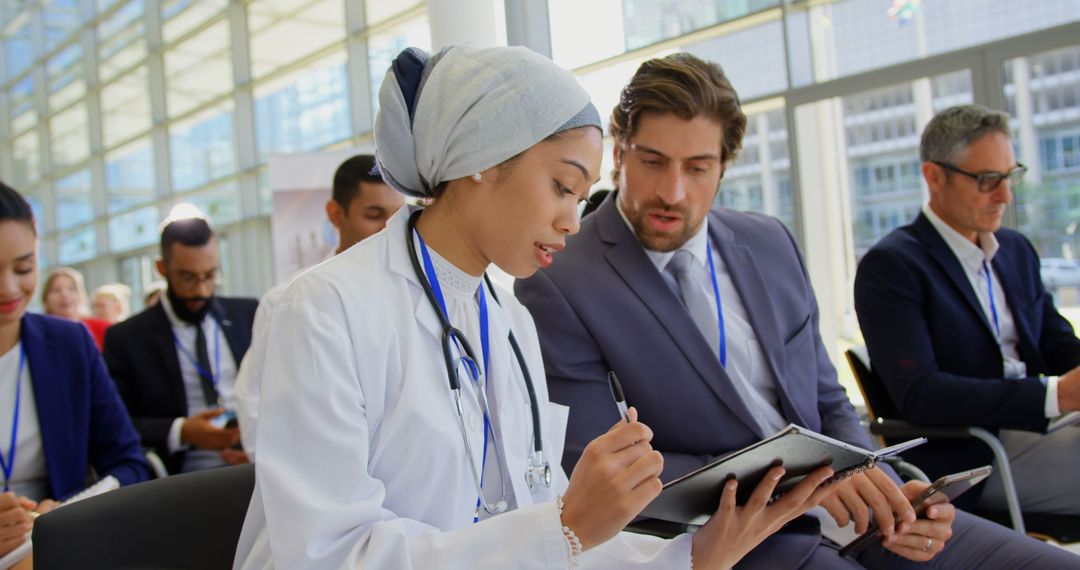 Female Doctor Using Tablet in Business Seminar Collaboration