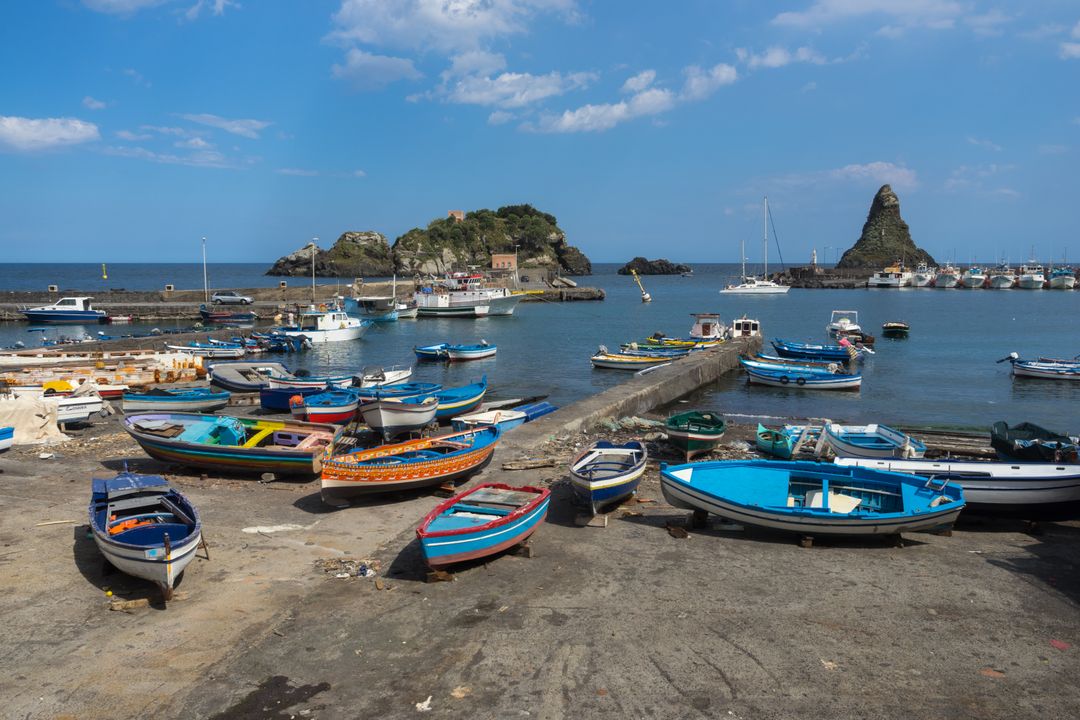 Colorful Fishing Boats and Serene Harbor with Rocky Islands - Free Images, Stock Photos and Pictures on Pikwizard.com