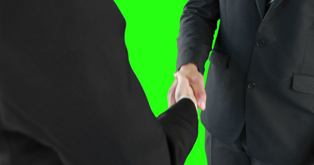 Two businessmen are shaking hands against a green screen background, with copy space - Free Images, Stock Photos and Pictures on Pikwizard.com
