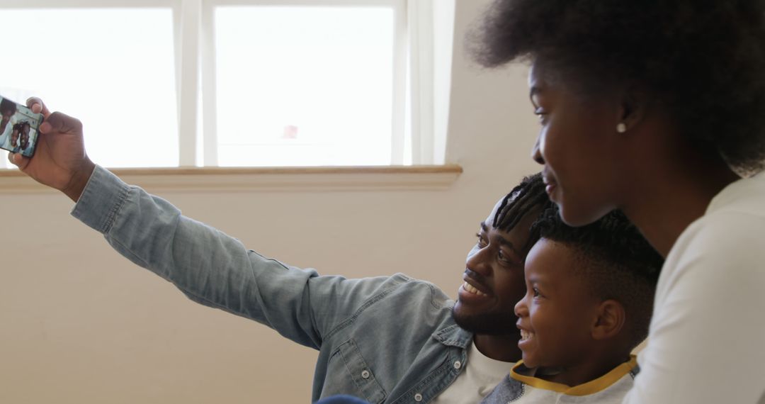 Happy African American family capturing selfie together - Free Images, Stock Photos and Pictures on Pikwizard.com