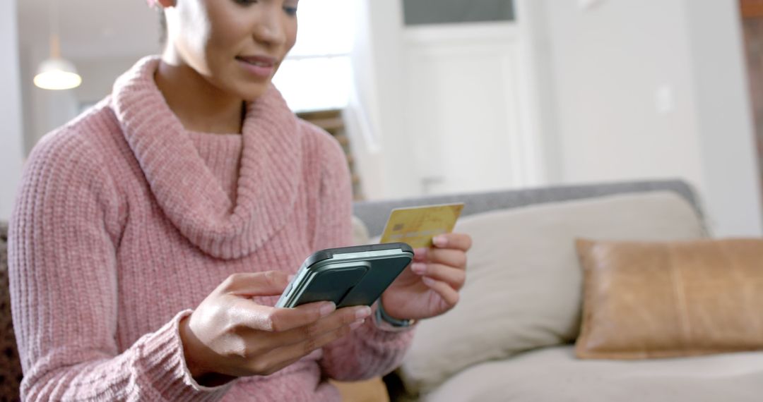 Woman Shopping Online at Home Holding Credit Card and Smartphone - Free Images, Stock Photos and Pictures on Pikwizard.com