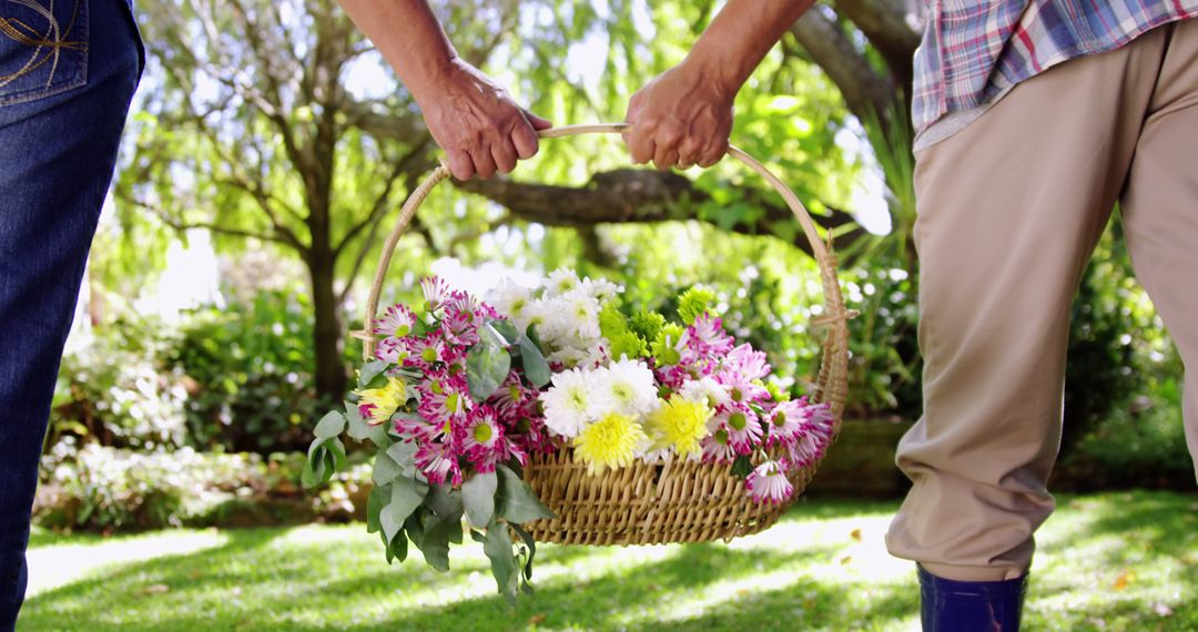 Close-Up of Senior Couple Holding Flower Basket in Garden - Free Images, Stock Photos and Pictures on Pikwizard.com