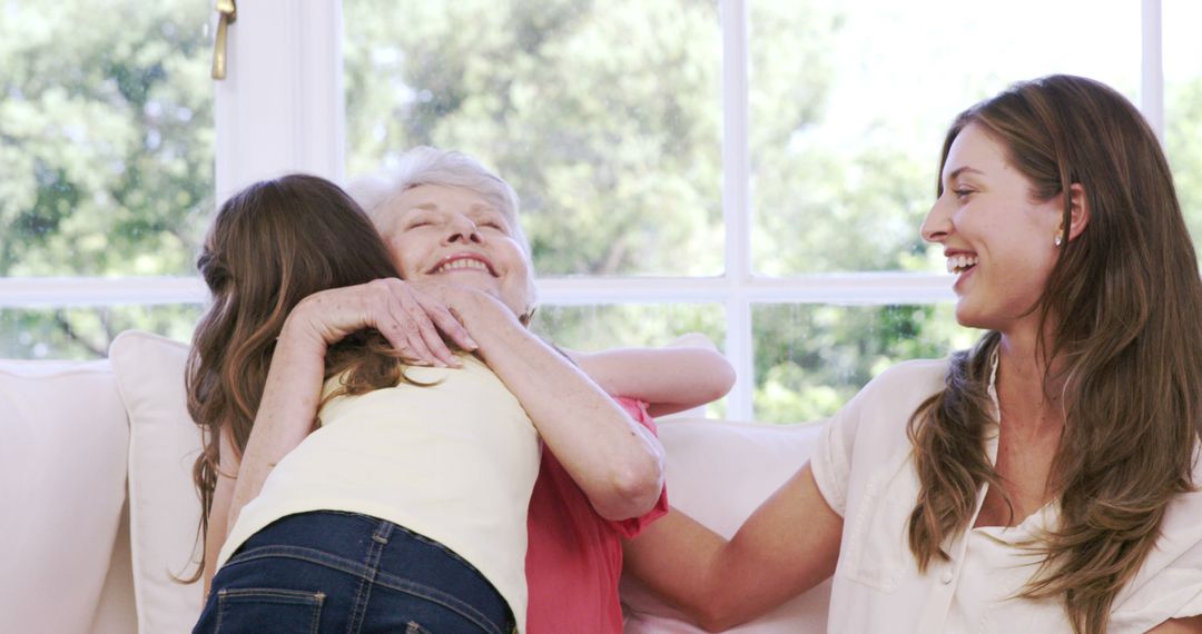 Three Generations of Women Hugging and Celebrating Family Time - Free Images, Stock Photos and Pictures on Pikwizard.com