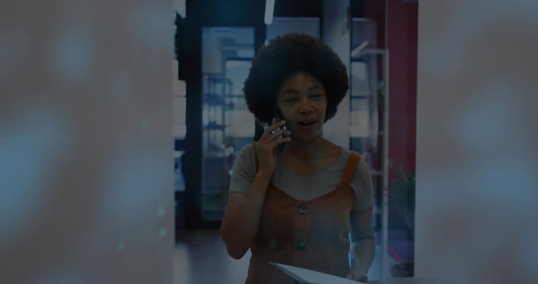 Confident Businesswoman Using Smartphone in Modern Office Setting