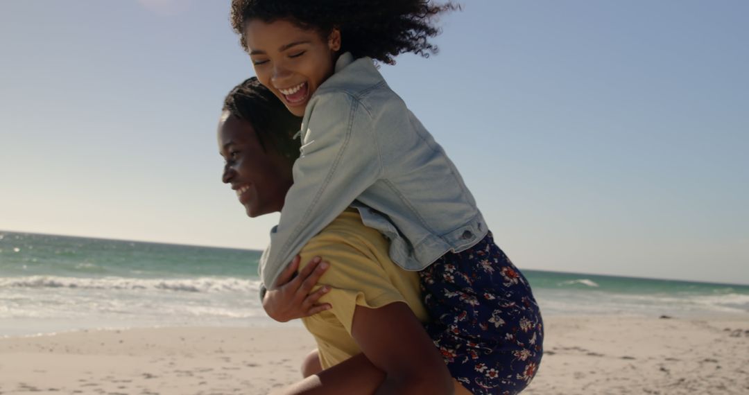 Joyful African American Friends Having Fun at Beach - Free Images, Stock Photos and Pictures on Pikwizard.com