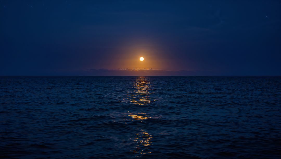Full Moon Rising Over Calm Ocean With Golden Reflection and Minimalist Night Horizon