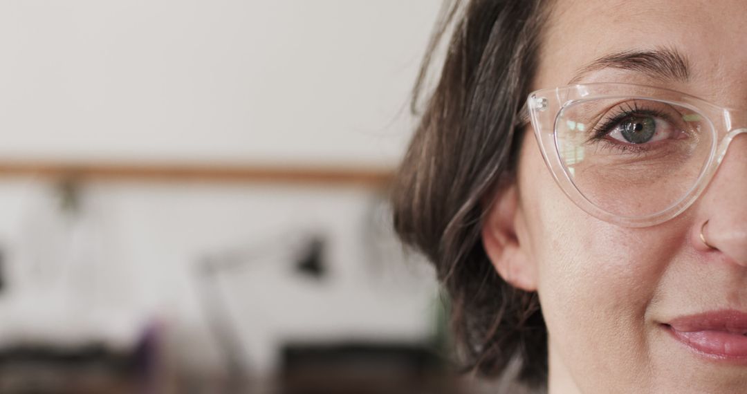 Close-Up of a Smiling Woman with Glasses in Office - Free Images, Stock Photos and Pictures on Pikwizard.com