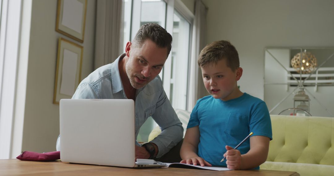 Father Helping Son with Homework Using Laptop - Free Images, Stock Photos and Pictures on Pikwizard.com