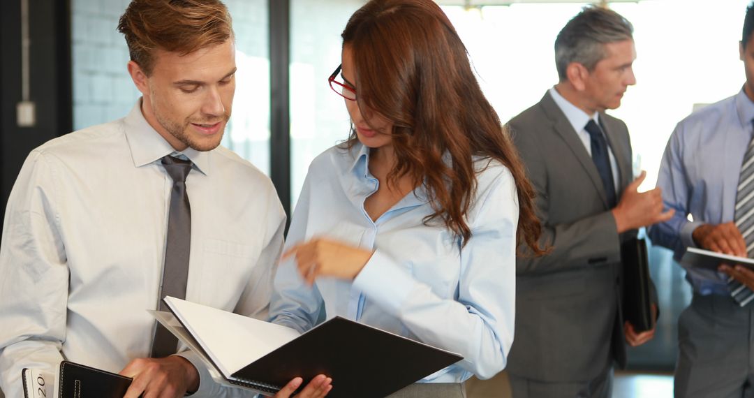 Professional Team Collaborating in Office Discussion